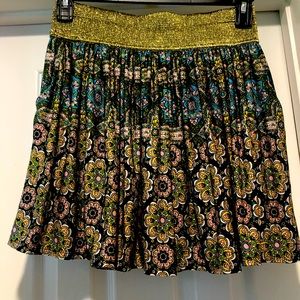 Baby Phat mini skirt size Large . Gold glitter embezzled waist. Side pockets